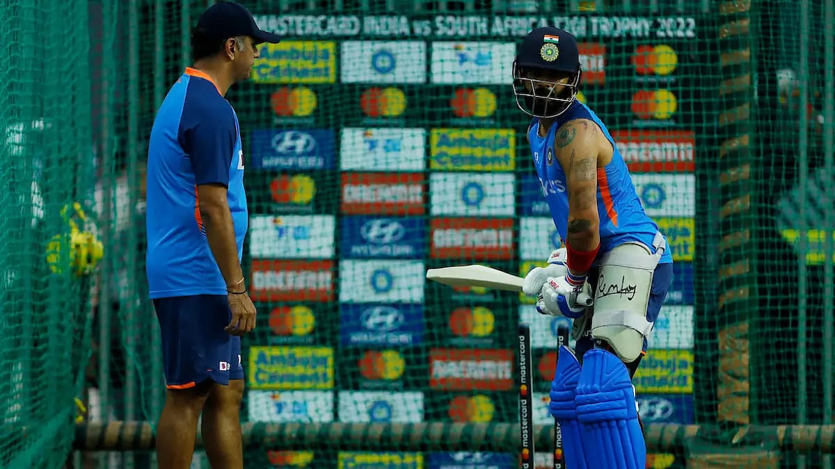 India coach Rahul Dravid gives batting tips to Virat Kohli at the nets in Guwahati on Saturday. 