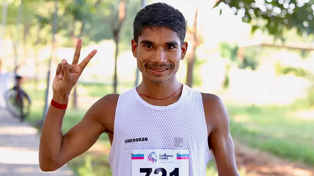 Ram Baboo celebrates after winning the men's 35km walk at the National Games 2022.