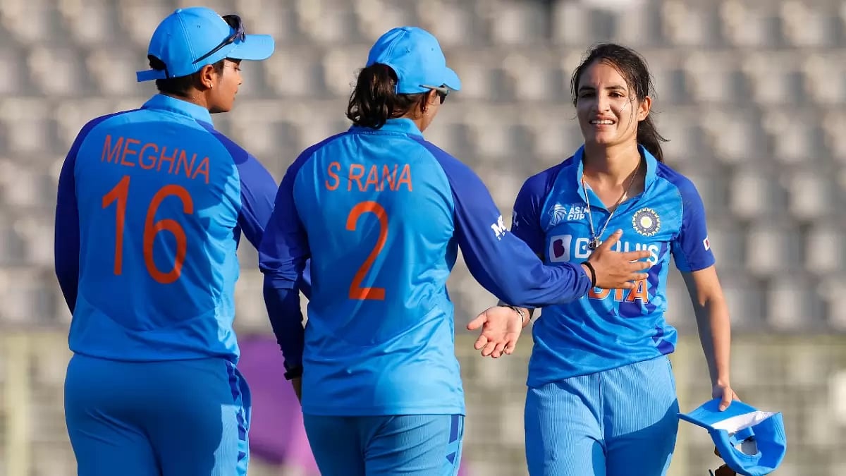 Renuka Singh (R) is congratulated by teammates after taking a Bangladeshi wicket on Saturday.