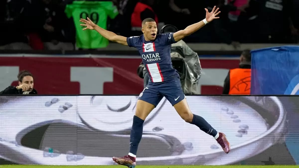 Kylian Mbappe celebrates after scoring for PSG against Benfica in UEFA Champions League. 