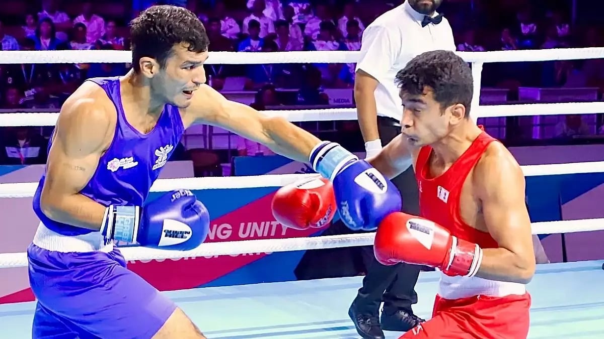 Action during a men's boxing event at National Games 2022. 