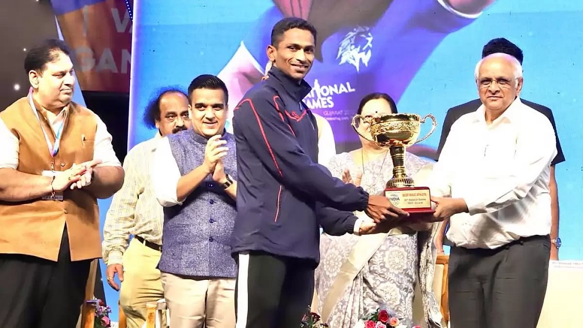 Sajan Prakash receives the trophy for best male athlete at National Games 2022.