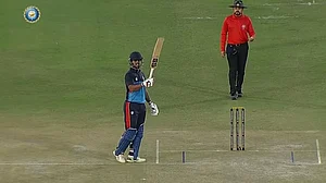 Delhi's Nitish Rana celebrates after completing his century against Punjab in Syed Mushtaq Ali tie.