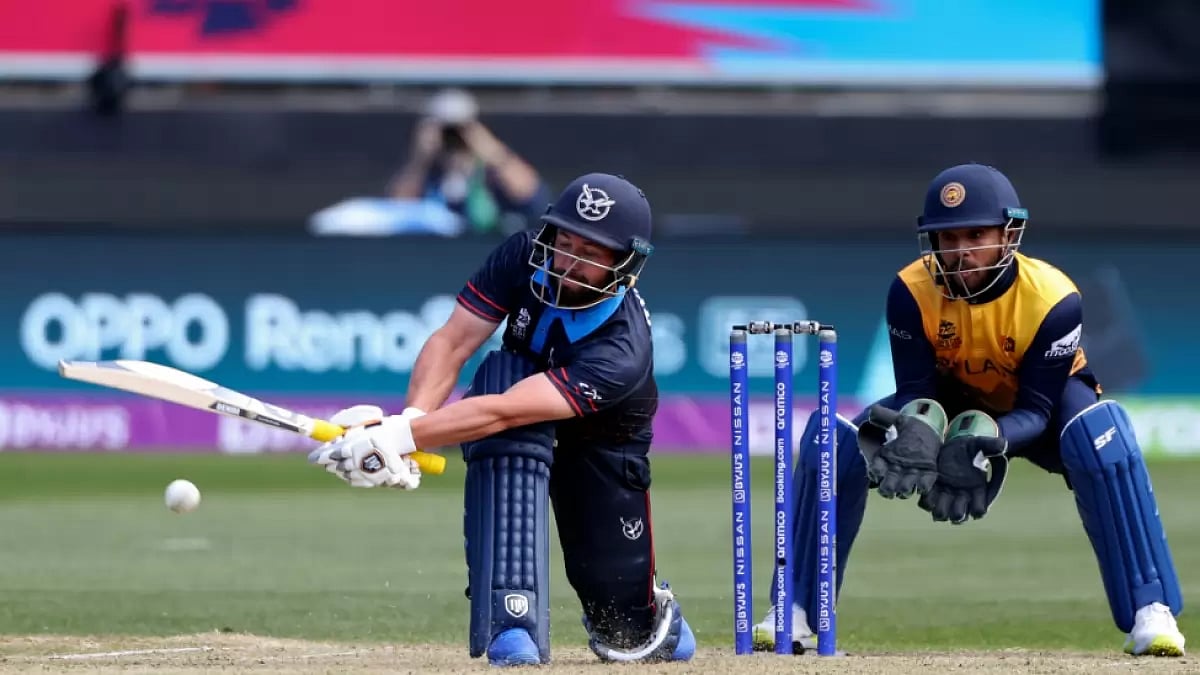 Namibia's Jan Frylinck plays a shot while Sri Lanka's Kusal Mendis looks on inT20 World Cup 2022.