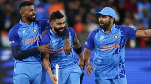 Virat Kohli celebrates India's win over Pakistan at the MCG with his teammates.