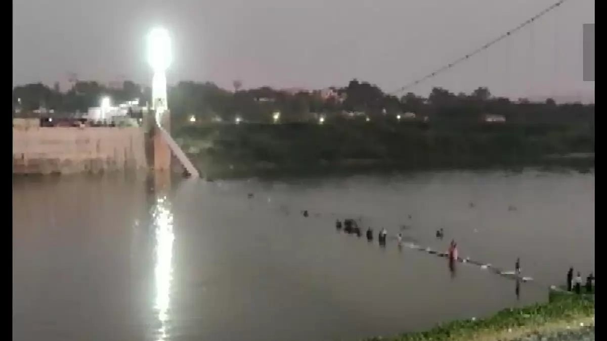 Image of collapsed cable car bridge in Gujarats Morbi.