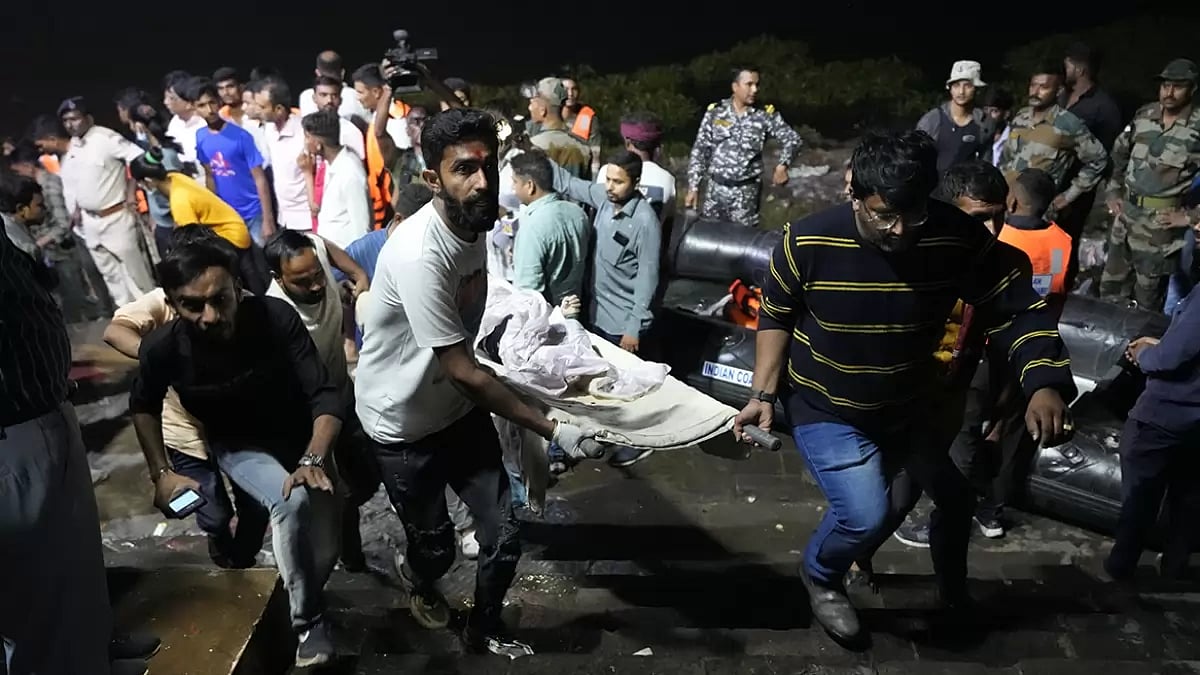 People being rescued after the collapse of Bridge in Gujarat