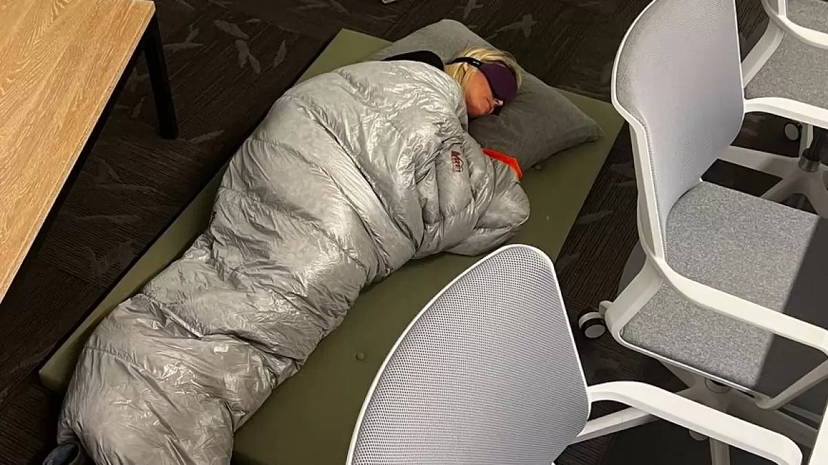 Twitter's director of product management Esther Crawford sleeping on office floor