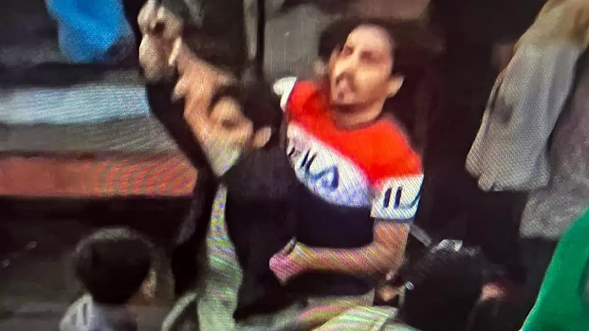 An unidentified man being captured after he fired on Pakistan's former prime minister Imran Khan and