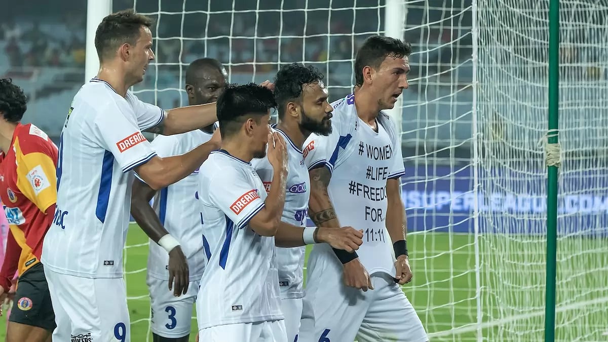 Vafa Hakhamaneshi celebrates with his team-mates after scoring the only goal of the match.