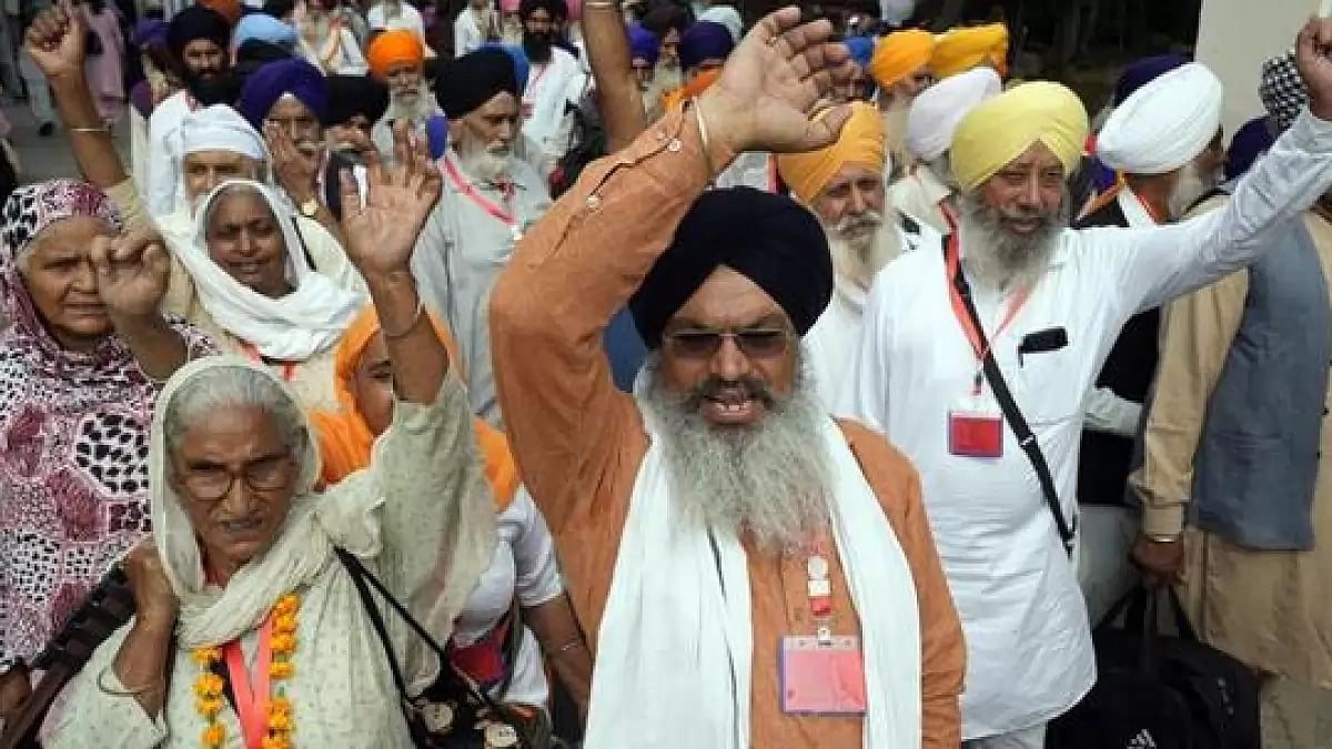 Sikh pilgrims entering Pakistan through the Attari-Wagah border near Lahore on Sunday. 