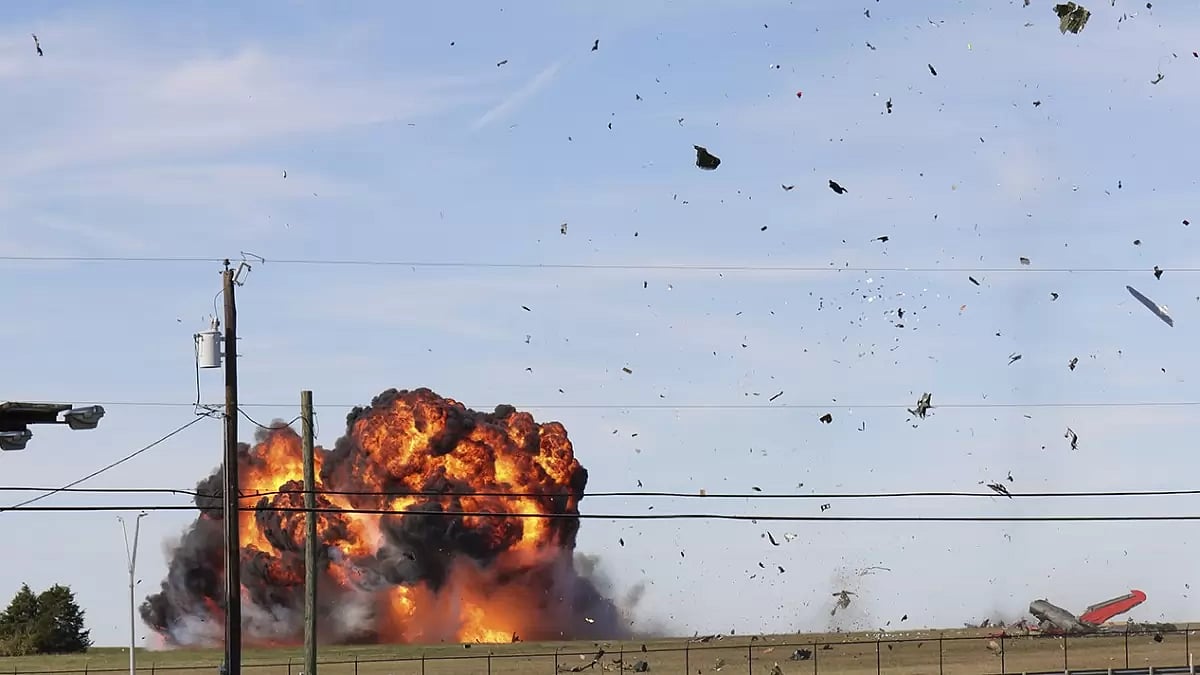 A fireball and wreckage photographed after two planes collided and crashed in Dallas, USA
