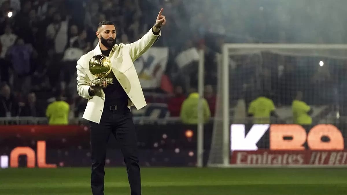 France's Karim Benzema shows off his 2022 Ballon d'Or trophy.