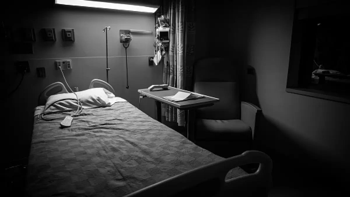 My mother frames the centre of the hospital photo – wide-eyed and beaming.