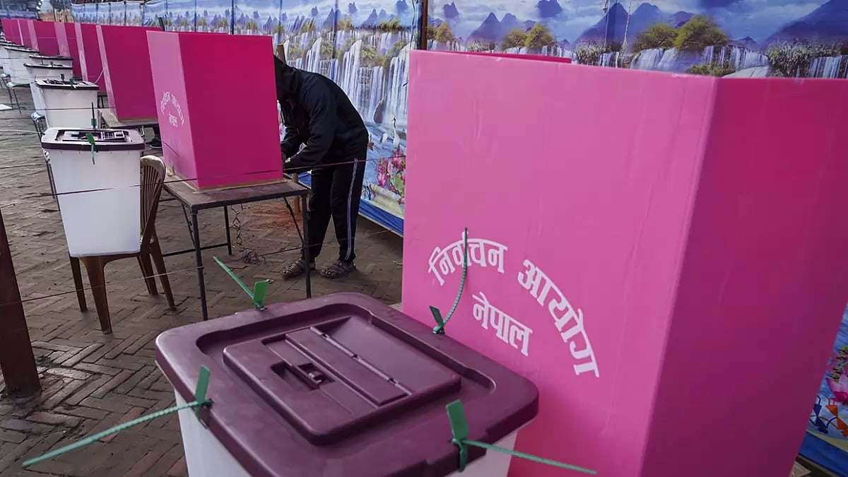 A man casts his vote during the general election in Kathmandu, Nepal.