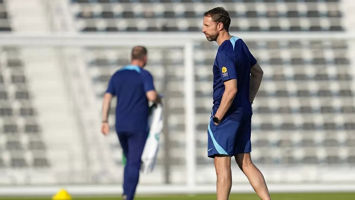 England coach Gareth Southgate keeps a close watch on players during his team's training.
