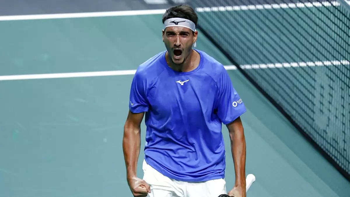 Lorenzo Sonego celebrates after winning the first set against Frances Tiafoe.