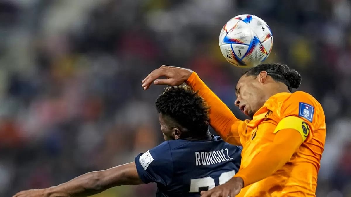 Ecuador's Kevin Rodriguez and Virgil Van Dijk of Netherlands contest for the ball.
