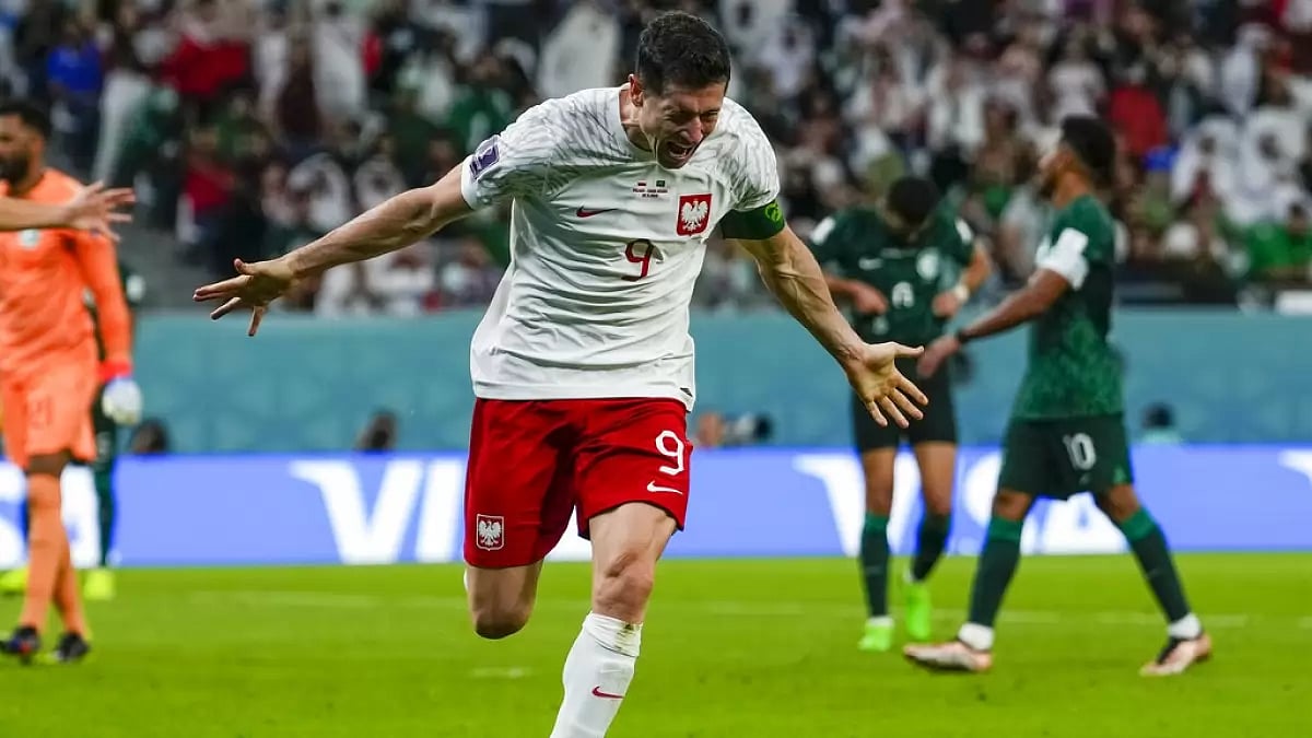 Robert Lewandowski celebrates after scoring Poland's second goal against Saudi Arabia.