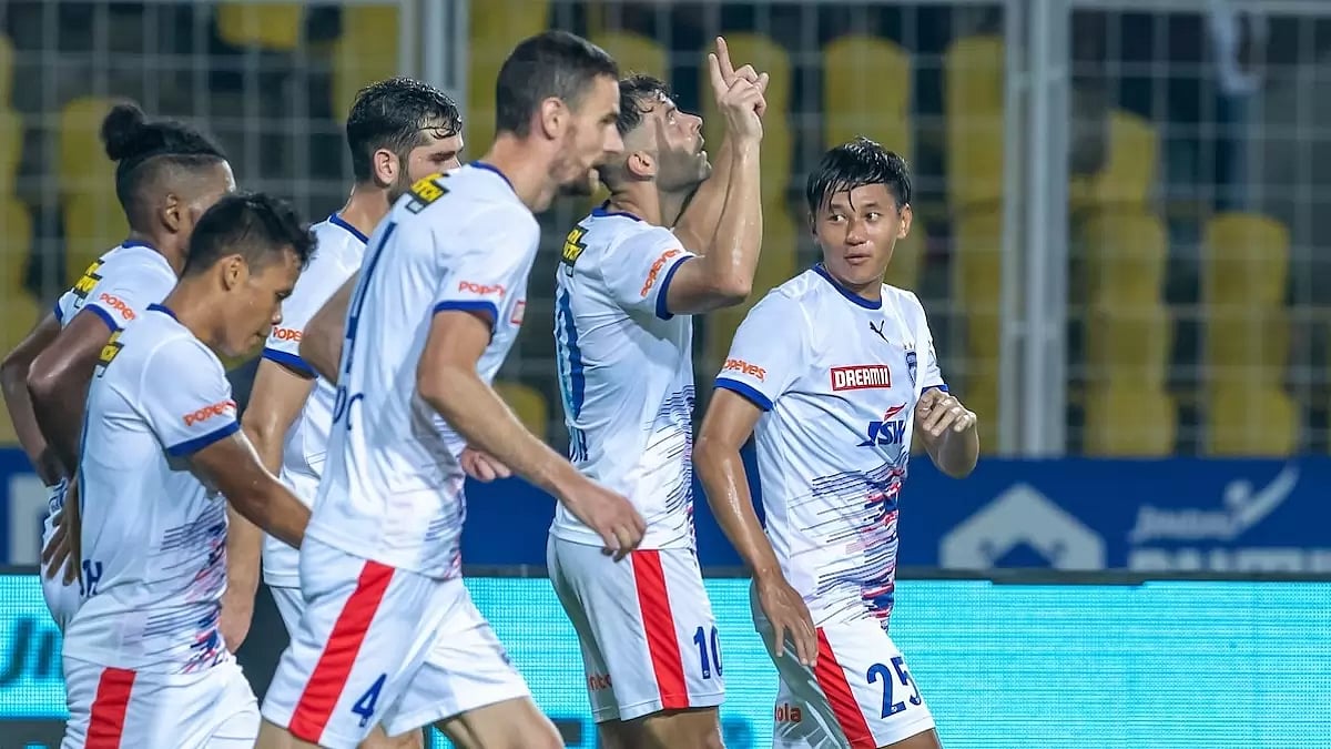 Hernandez celebrates with Bengaluru teammates after scoring his second goal.