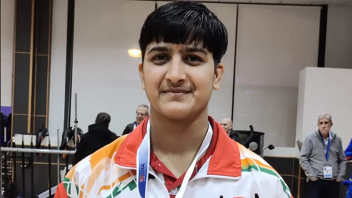 Ravina poses with her medal after winning her bout.