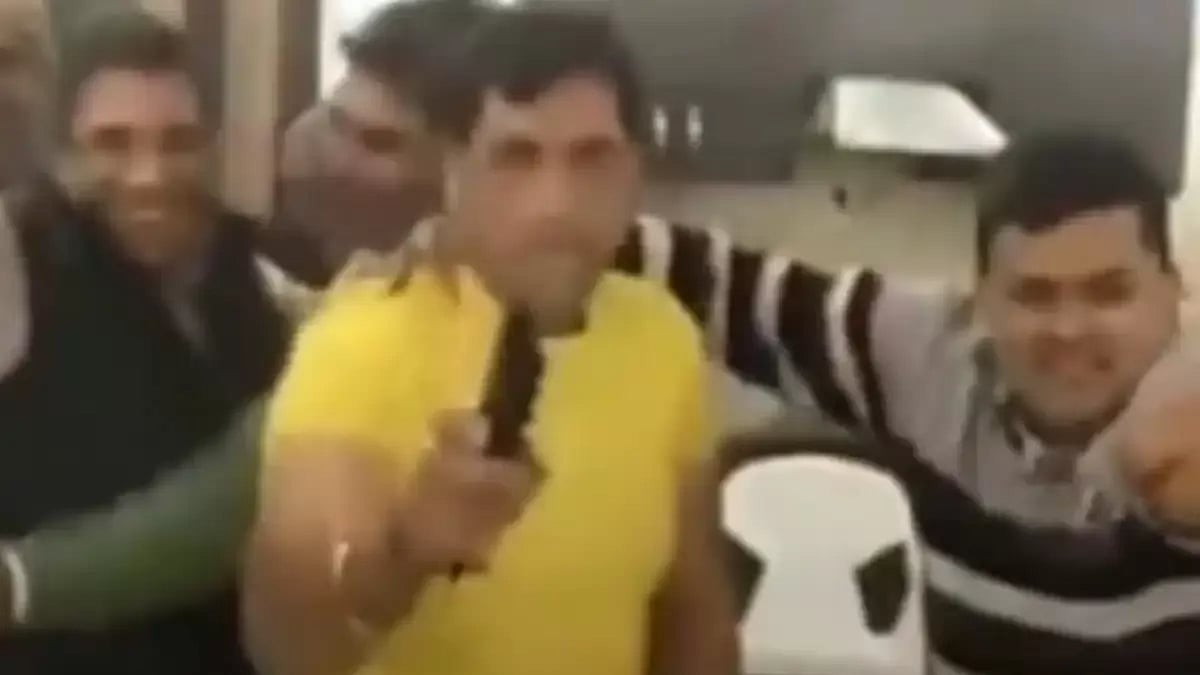 Video grab of AAP MCD candidate Joginder Singh dancing with the pistol