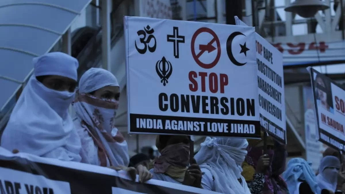Women associated with India Against Love Jihad hold placards in Bhopal 
