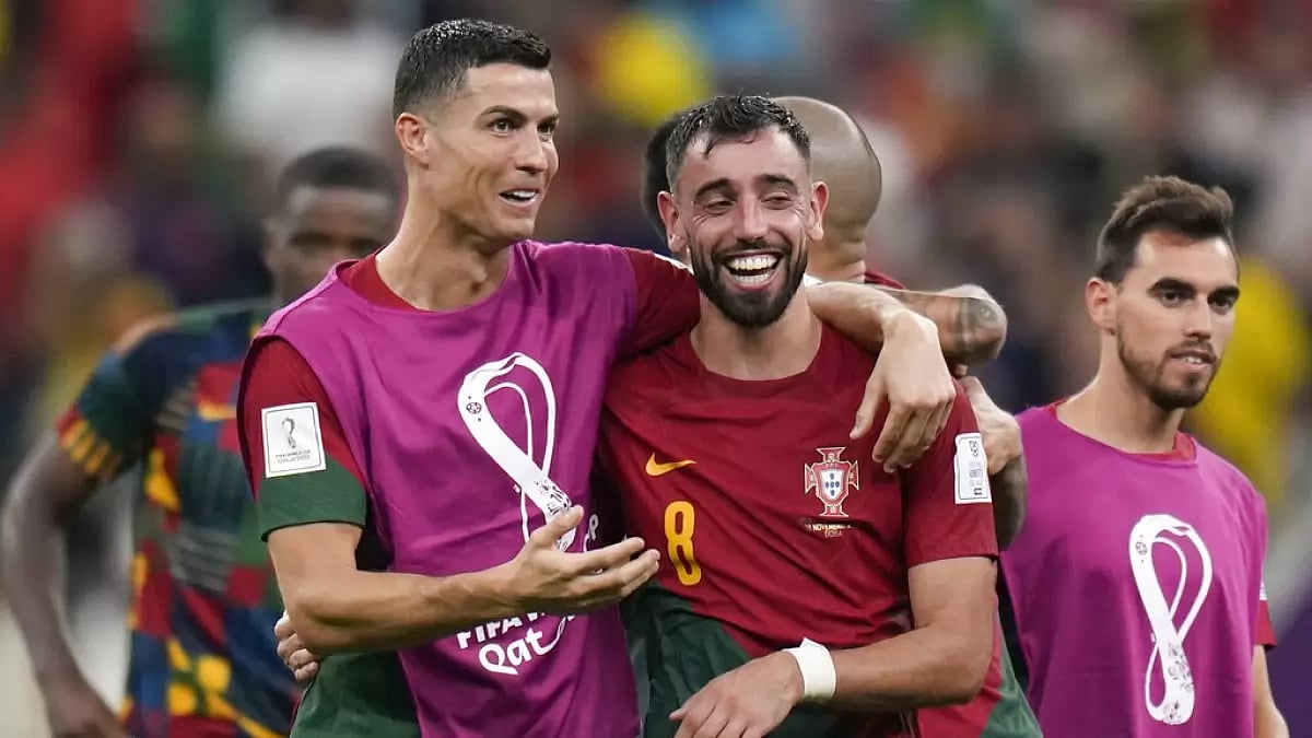 Portugal teammates Cristiano Ronaldo and Bruno Fernandes celebrate after their win over Uruguay.