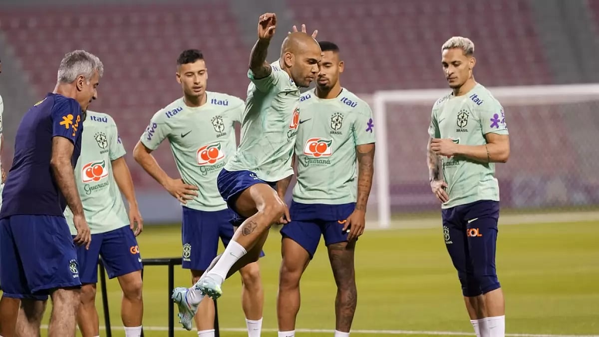 Brazil's Dani Alves trains as his teammates look on ahead of their match against Cameroon.