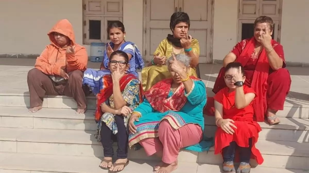 Visually impaired people vote in Gujarat elections.
