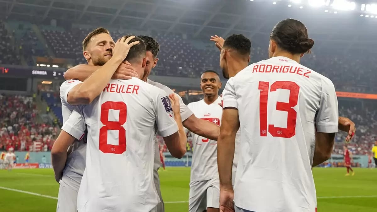 Switzerland players celebrate after scoring the third goal against Serbia. 