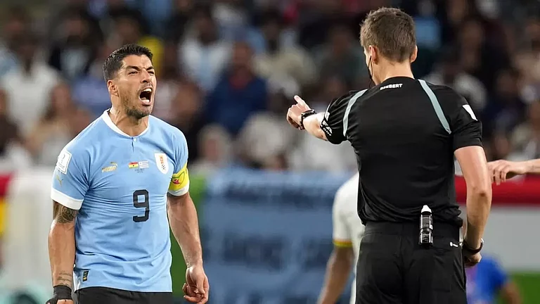 Suarez's outburst against referee Daniel Siebert earned him a yellow card against Ghana. - null