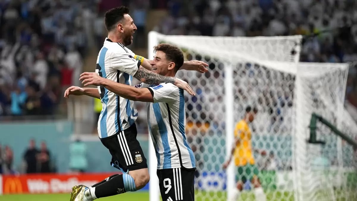 Álvarez celebrates with Messi after scoring his team's second goal against Australia on Saturday.