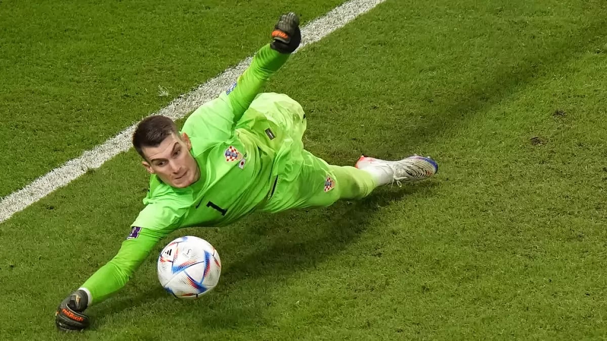 Croatia's Dominik Livaković saves a penalty during his team's match against Japan on Monday.
