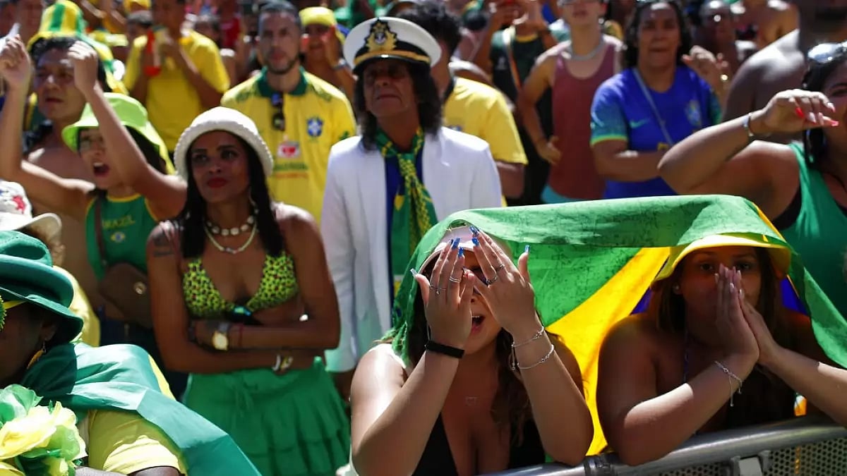 Brazil football fans react after their team's WC match against Croatia ended in a defeat.