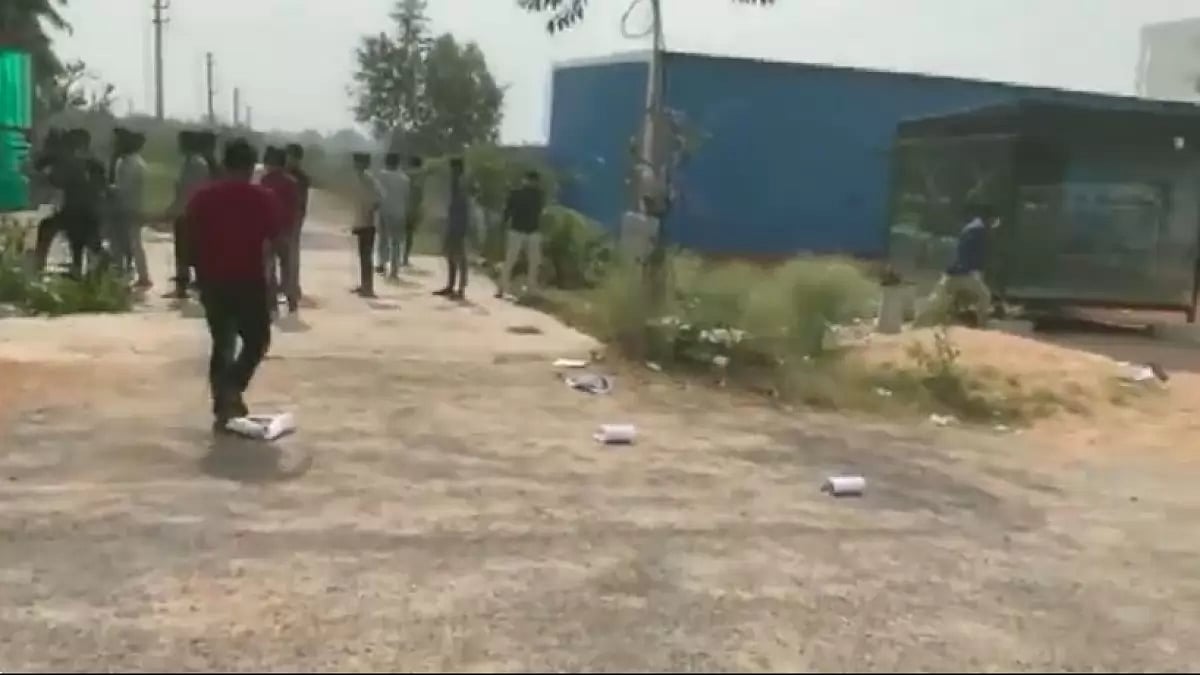 Video grab of the footage of a mob barging into the woman's house.