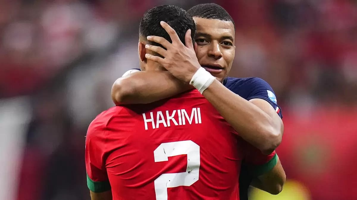 France's Mbappe hugs Hakimi after beating Morocco in the semifinal on Wednesday.