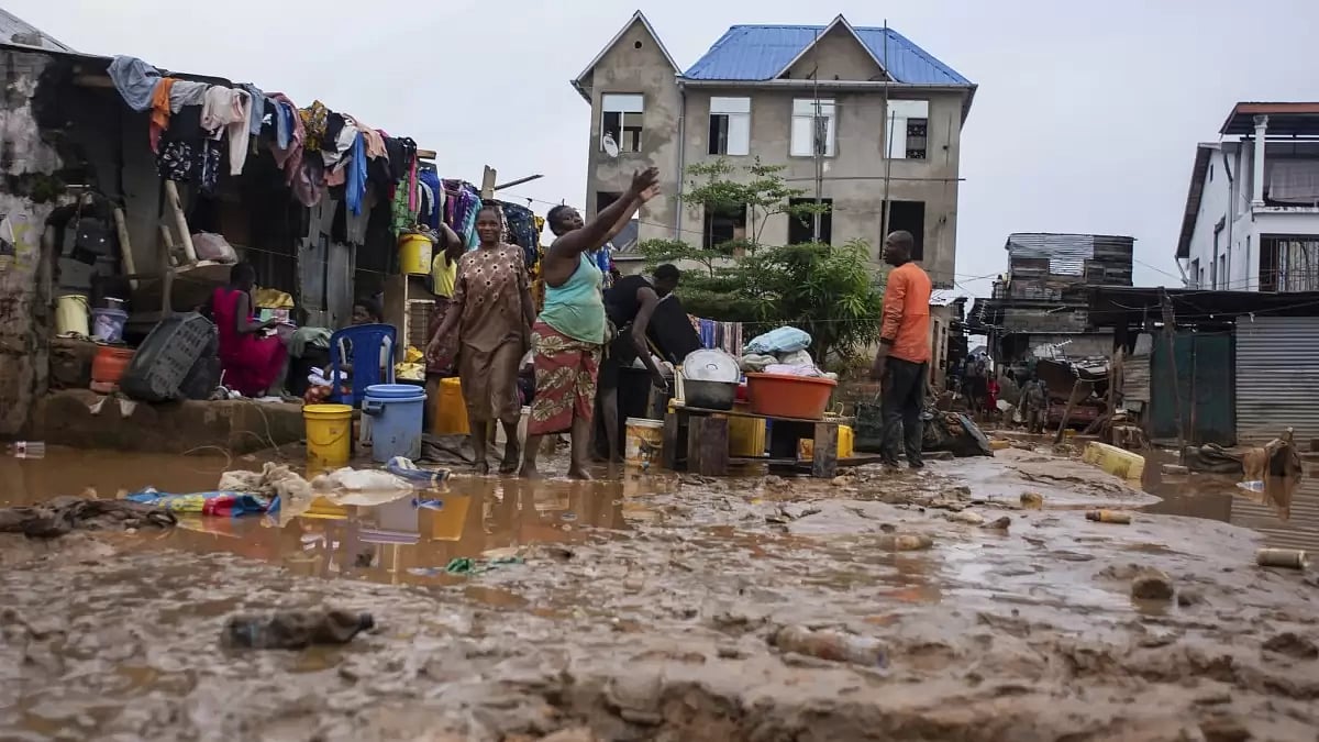 Residents clean up following torrential rains in Congo's capital city Kinshasa.