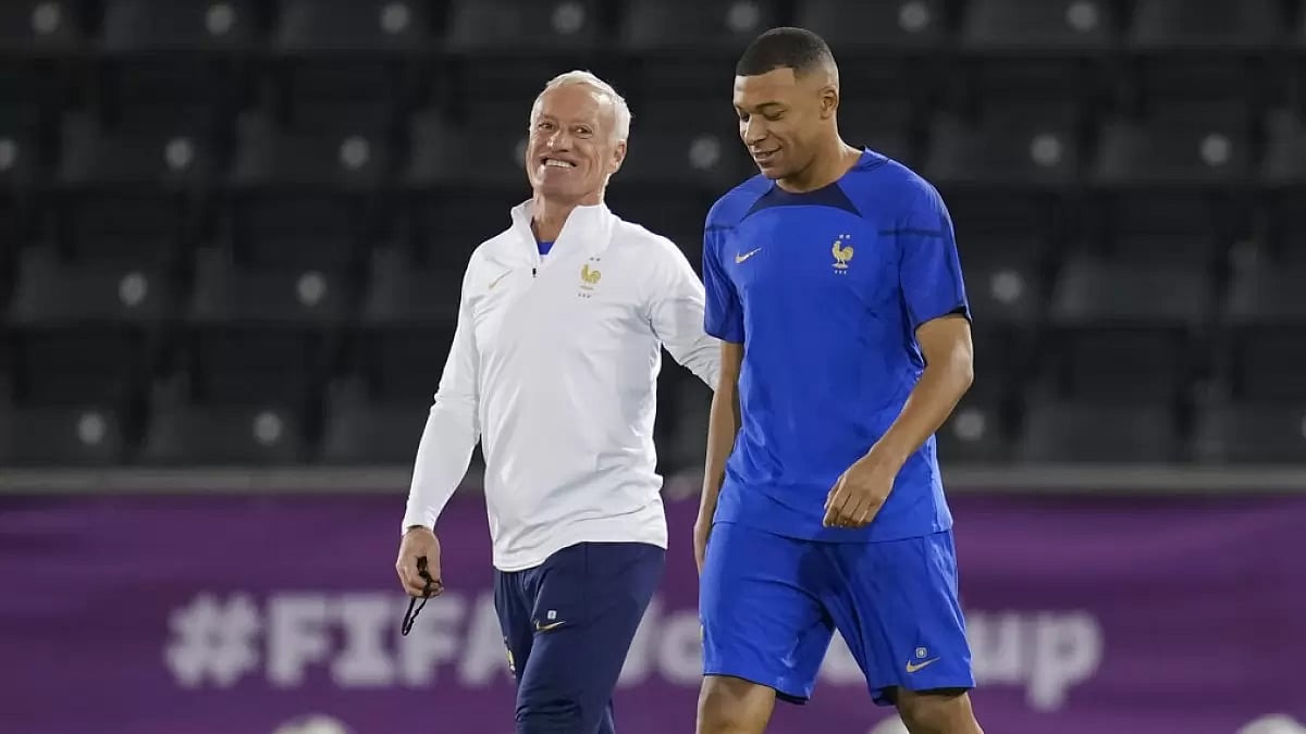 France coach Didier Deschamps (L) arrives for a team training session with Mbappe.