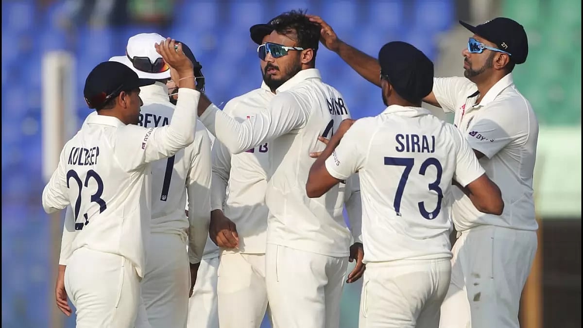Axar Patel, centre, celebrates with his teammates after getting Mushfiqur Rahim's wicket on Day 4.