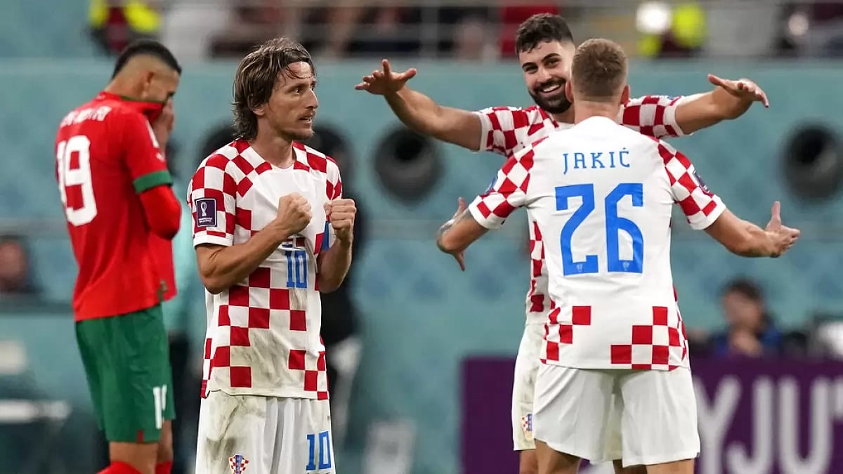 Croatian players celebrate their team's win against Morocco on Saturday.