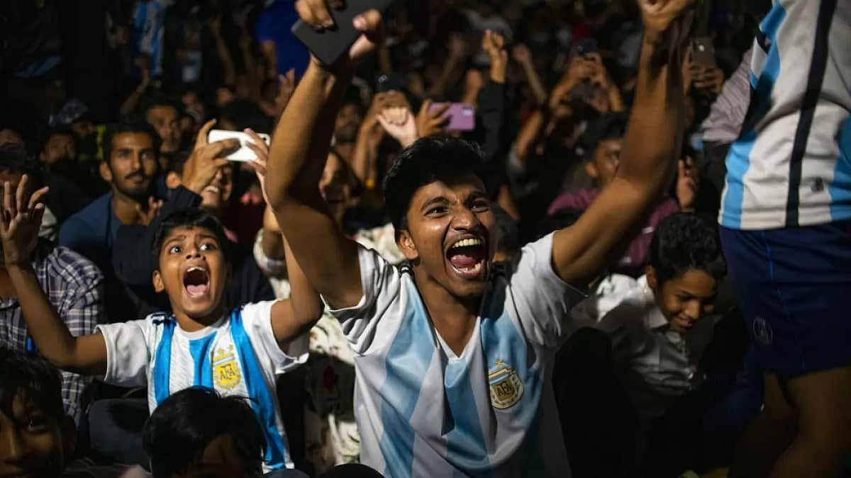 Football fans in Kochi, India, celebrate Argentina's win over France in the WC final on Sunday.
