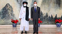 Analysis: A String Of ISIS-K Attacks In Afghanistan Puts China’s Ambitions In A Fix Taliban co-founder Mullah Abdul Ghani Baradar left, and Chinese Foreign Minister Wang Yi