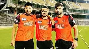Vivrant Sharma, centre, plays as an all-rounder for Jammu & Kashmir team.
