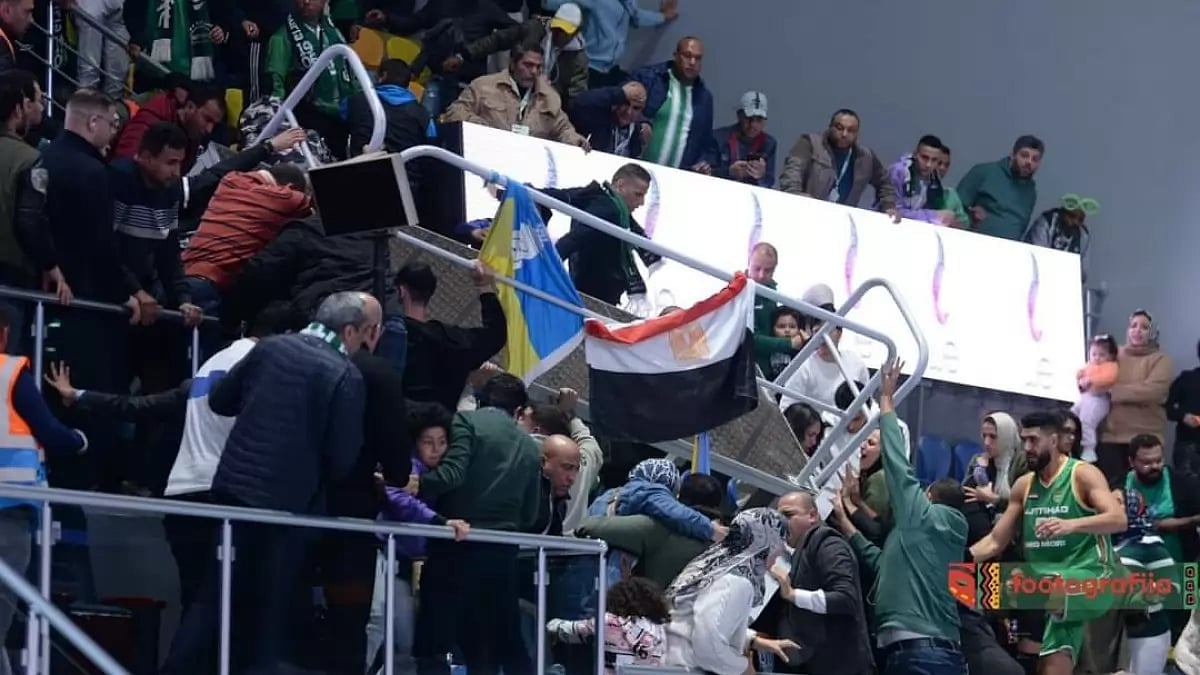Spectators look on in disbelief after a stand partially collapsed during a basketball game in Egypt.