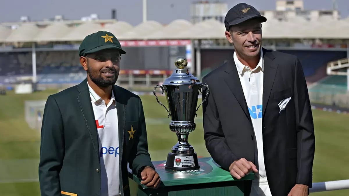 Babar Azam and his counterpart Tim Southee pose for a photo with the Test series trophy in Karachi.