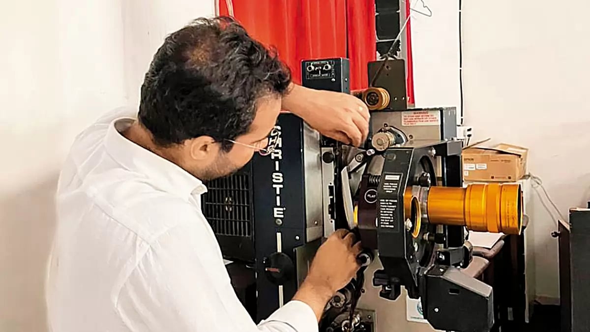 The Man in the Booth­: Karan Suri Talwar behind a 35-mm projector at Harkat Studios