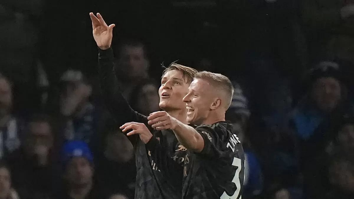 Odegaard, left, celebrates after scoring Arsenal's second goal against Brighton on Saturday.