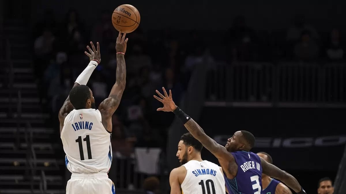 Irving makes a jump shot over Terry Rozier on Saturday.
