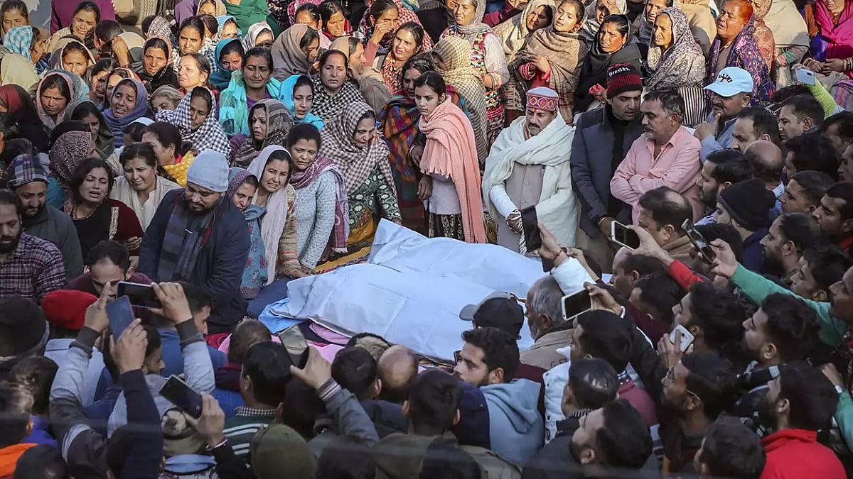 Family members mourn near mortal remains of civilians in Dhangri area of Rajouri.